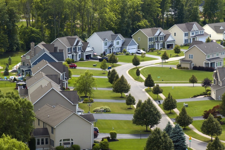 Top view of expensive two story private houses in Rochester NY suburbia\. New family homes in upscale community\. Real estate development in american suburbs\.